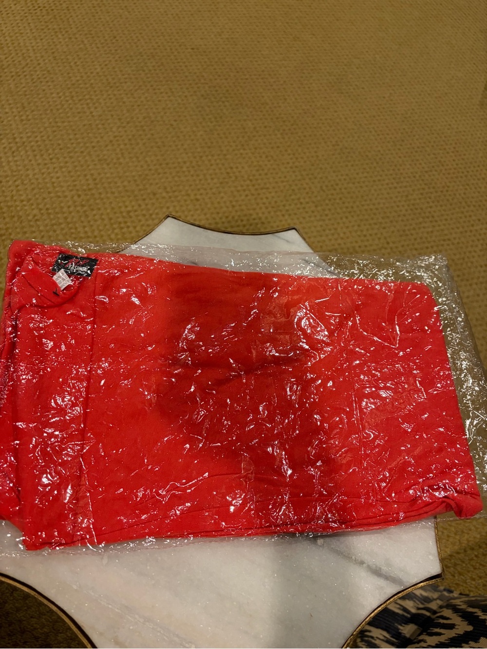Coral light weight infinity scarf with zip pocket.